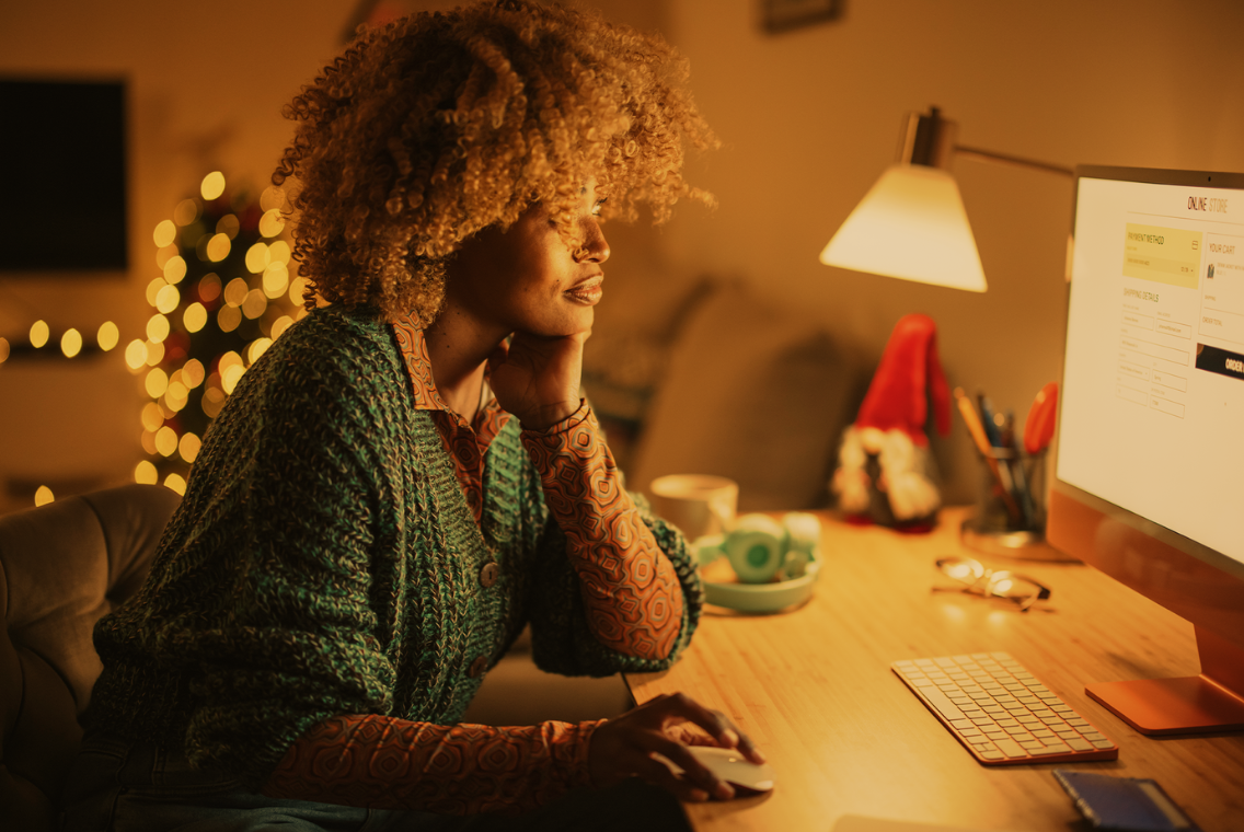 woman scrolling on computer 
